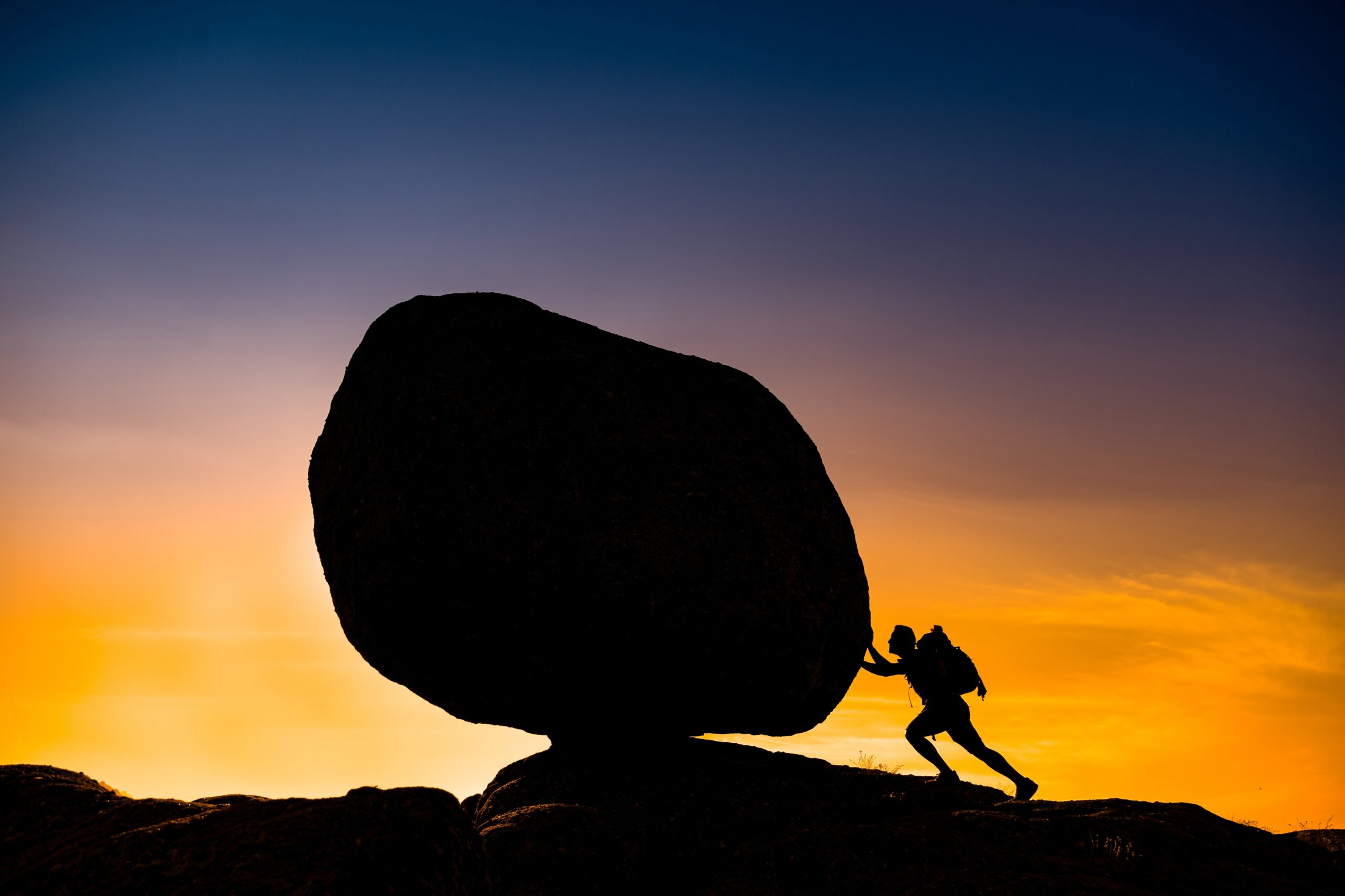 silhouette shot a male hiker holding a huge stone 2023 11 27 05 19 40 utc scaled